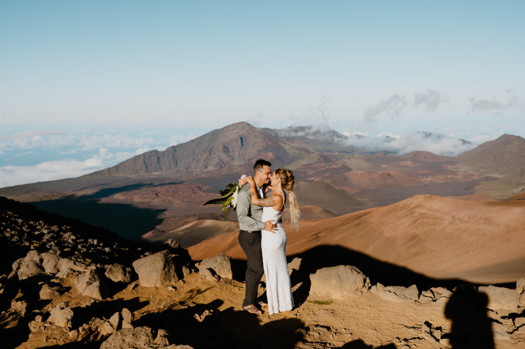 A couple hugs in Haleakala National Park at a Sunrise Elopement