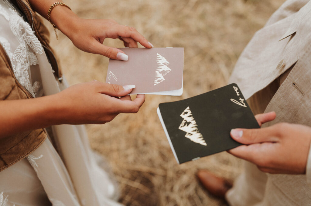 A couple's vow books are  shown during their elopement ceremony.