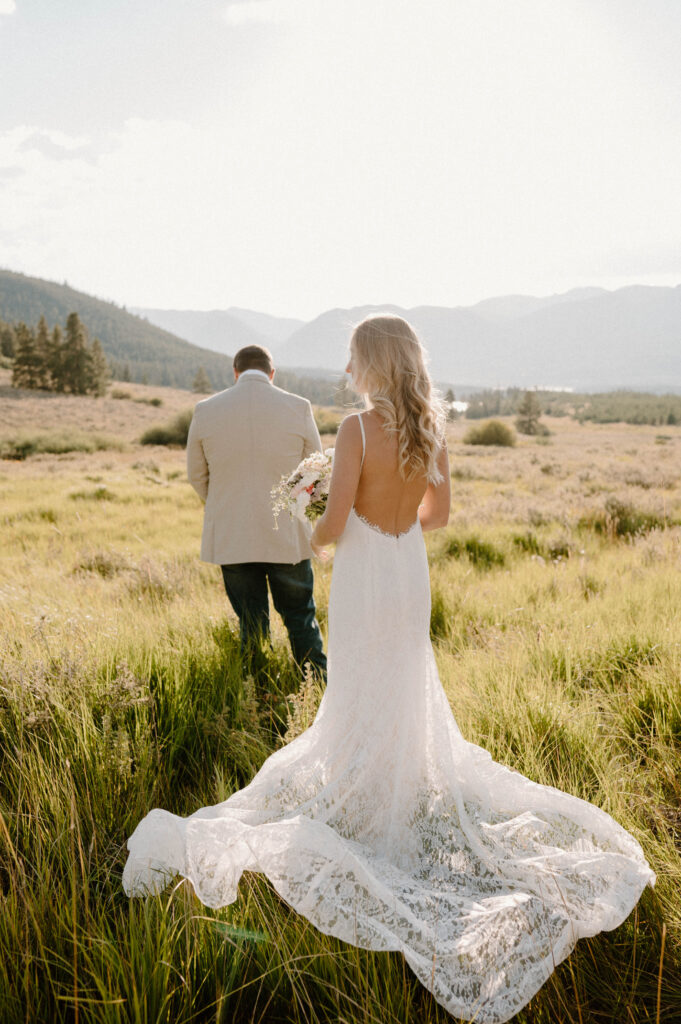 A bride and groom prepare for their first look near Dillion, Colorado. 