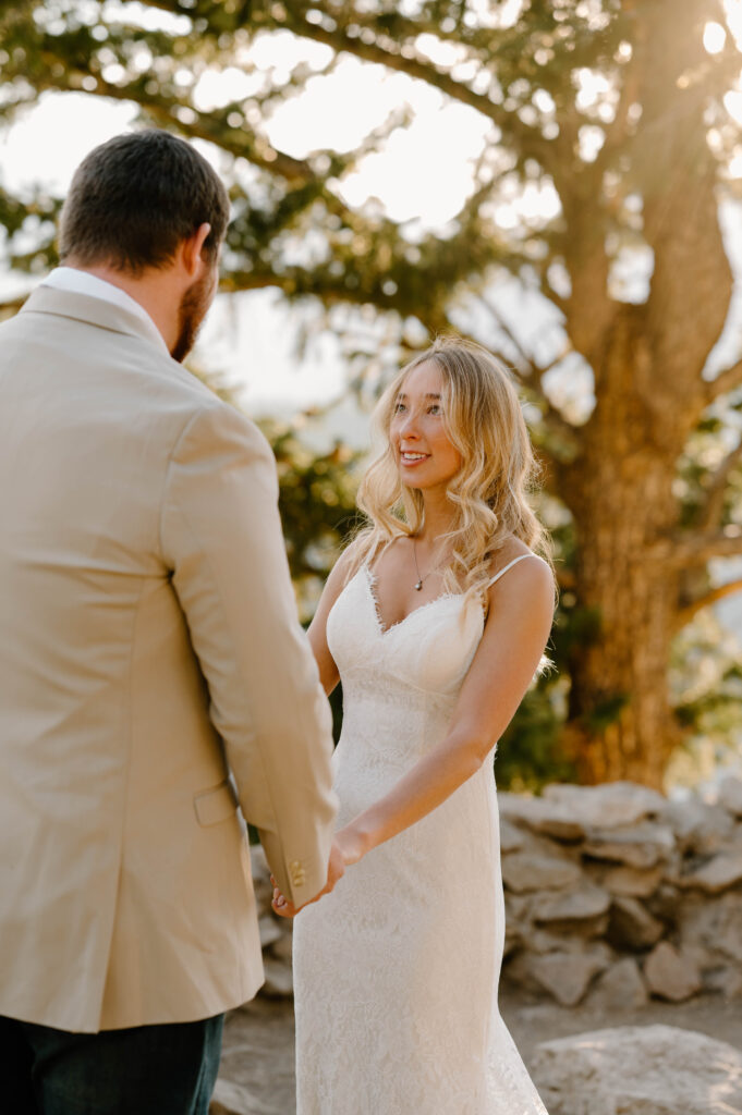 The sun shines through a bride's hair during her ceremony atop Sapphire Point Overlook. 