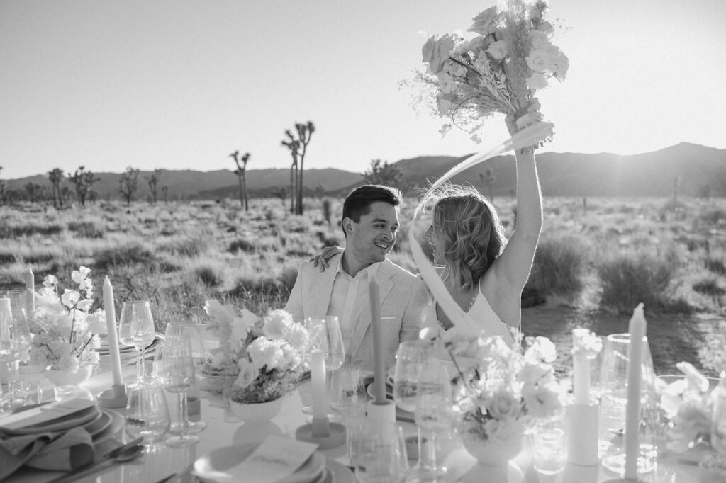 A couple celebrates their Joshua Tree elopement with an intimate tablescaape reception