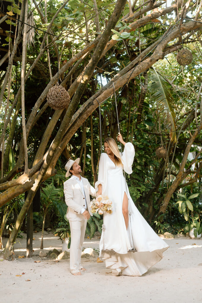 A married couple stands in a Mexican jungle near Tulum