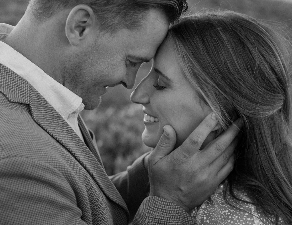 A man rests his forehead on his wife's after their Colorado elopement.