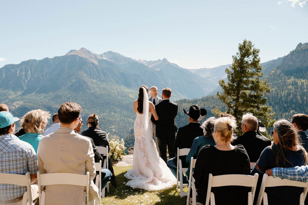 A bride and groom exchange vows during their ouray colorado elopement.