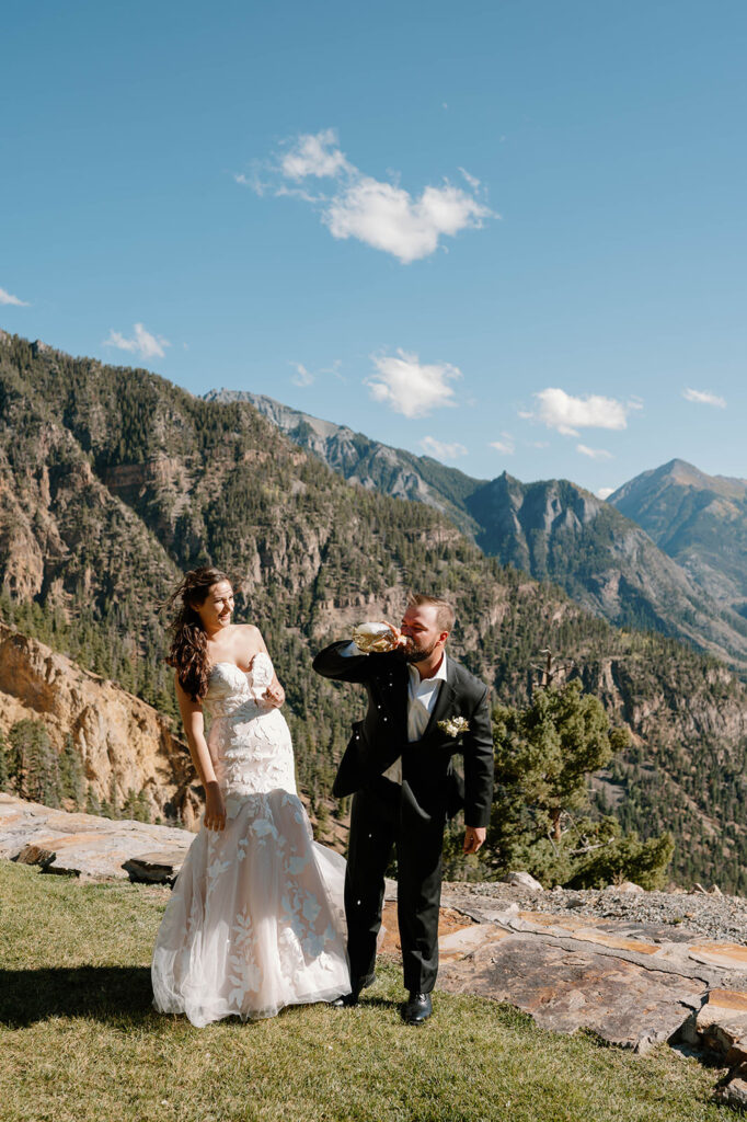 A couple shares champagne on a mountainside during their Ouray elopement.