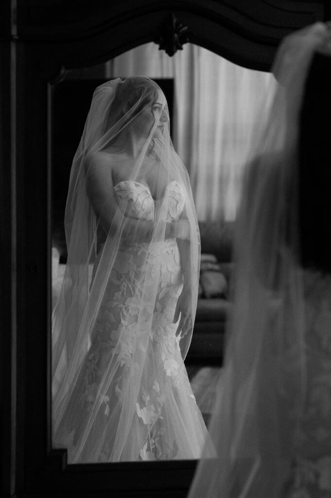 A woman gets ready in her bridal suite before her mountain elopement in Ouray.