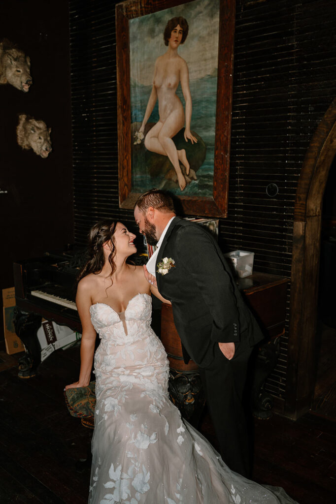 A newlywed couple sits at the bar in The Western Hotel & Spa's Saloon in Ouray, Colorado. 