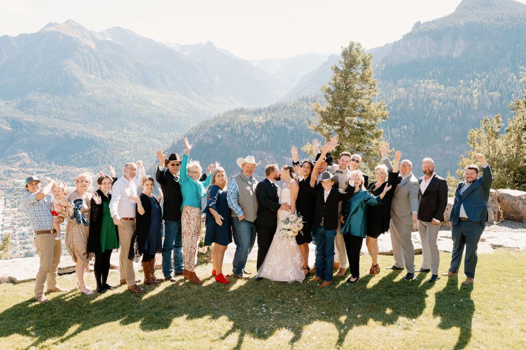 A couple's family poses for a group portrait during their wedding celebration in Ouray. 