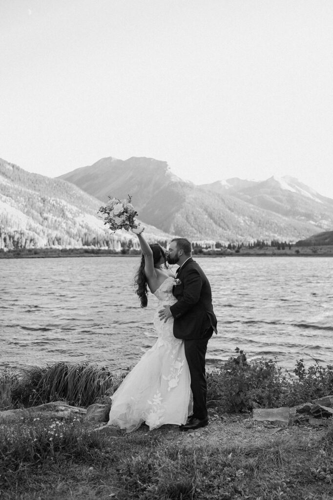 A couple celebrates their Ouray Colorado elopement near a mountain lake. 