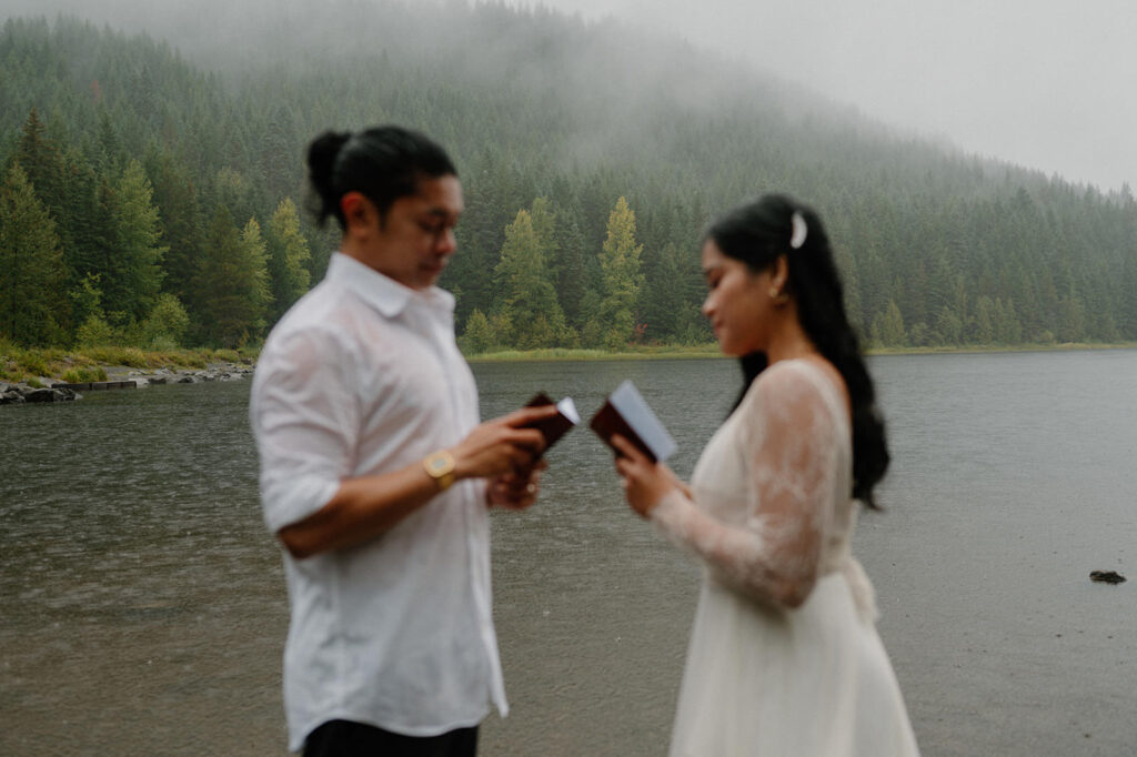 A couple exchanges elopement vows by Trillium Lake.
