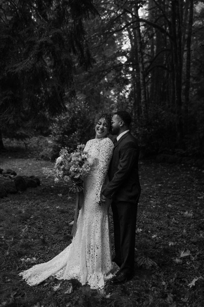 A couple shares a laugh during their Oregon Airbnb elopement.