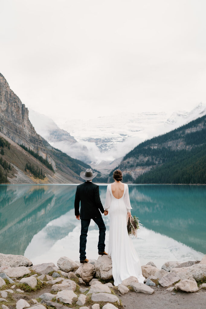 A man and woman elope in Banff during the Fall at Lake Louise.