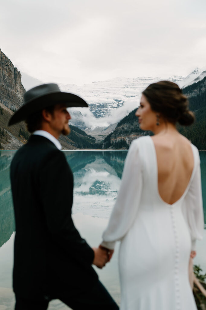 A bride and groom elope in Banff at Lake Louise in Autumn. 