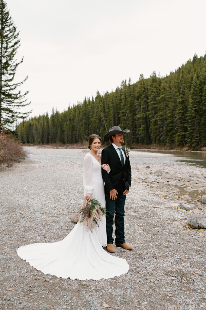 A couple poses for an elopement portrait during their Banff ceremony in Canada.