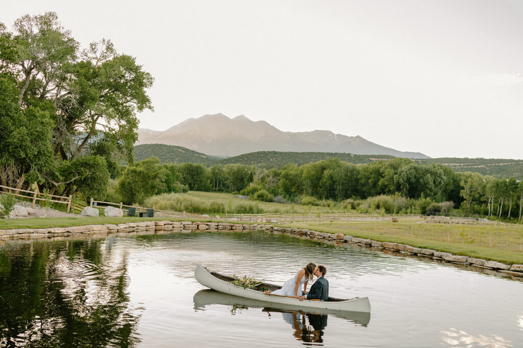 A Shaw's River Ranch wedding on a pond that sits beneath the peaks of the Colorado Rockies. 