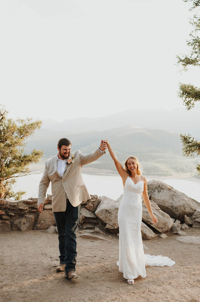 A couple celebrates their elopement at Sapphire Point Overlook near Breckenridge, Colorado. 